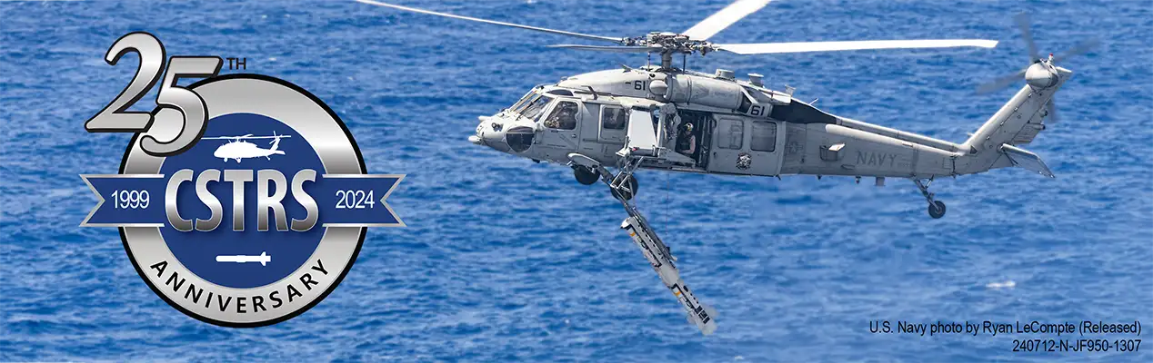 CSTRS 25th Anniversary, a U.S. Navy Seahawk helicopter lowers an Airborne Mine Neutralization System into the water using the CSTRS system